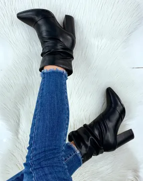 Bottines noires plissées à talon et bout pointu